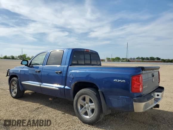 2010 Dodge Dakota Laramie z VIN 1D7CW5GP3AS232289, wystawiony jako Copart lot #56669655 z przebiegiem 171 796 mil mil oraz Szkoda całkowita • Salvage title. Historia ofert i sprzedaży dostępna na DreamBid. Obrazek 2.