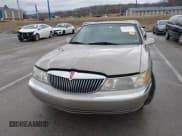 ✅ 2001 Lincoln Continental • VIN: 1LNHM97VX1Y627039 • Lot: 41482016. Listed on IAAI with 143,317 mi. Free auction sales archive from the USA and detailed vehicle history report at DreamBid. Image 12.