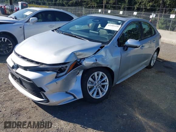 ✅ 2023 Toyota Corolla Hybrid LE • VIN: JTDBCMFE7P3026002 • Лот: 43389358. Опубликован ранее на IAAI с пробегом 23 628 миль. Бесплатный доступ к архиву аукционных продаж из США и подробный отчёт об истории автомобиля на DreamBid. Изображение 2.