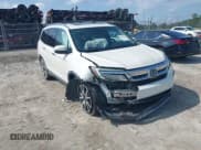 ✅ 2019 Honda Pilot Touring 8-Passenger • VIN: 5FNYF5H9XKB001842 • Lot: 43026784. Listed on IAAI with 114,674 mi. Free auction sales archive from the USA and detailed vehicle history report at DreamBid. Image 1.