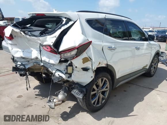 ✅ 2017 Hyundai Santa Fe Ultimate • VIN: 5NMZW4LA1HH042352 • Lot: 42753102. Listed on IAAI with 86,473 mi. Free auction sales archive from the USA and detailed vehicle history report at DreamBid. Image 4.