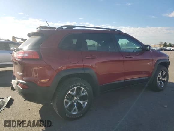 ✅ 2015 Jeep Cherokee Trailhawk • VIN: 1C4PJMBS0FW563072 • Lot: 92593655. Listed on Copart with 64,401 mi. Free auction sales archive from the USA and detailed vehicle history report at DreamBid. Image 3.