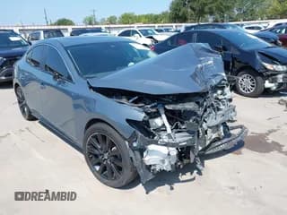 ✅ 2023 Mazda 3 S Carbon Edition • VIN: 3MZBPACM4PM365617 • Lot: 42941176. Listed on IAAI with 62,363 mi. Free auction sales archive from the USA and detailed vehicle history report at DreamBid. Image 1.