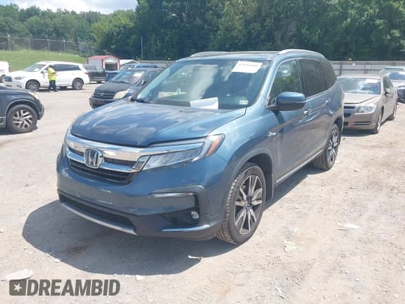 ✅ 2022 Honda Pilot Touring 7-Passenger • VIN: 5FNYF6H6XNB015742 • Lot: 42832149. Listed on IAAI with 101,054 mi. Free auction sales archive from the USA and detailed vehicle history report at DreamBid. Image 2.