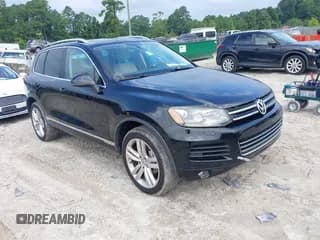 ✅ 2012 Volkswagen Touareg Lux • VIN: WVGEK9BP4CD009470 • Lot: 42949410. Listed on IAAI with 173,169 mi. Free auction sales archive from the USA and detailed vehicle history report at DreamBid. Image 1.