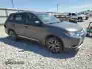 2018 Mitsubishi Outlander ES with VIN JA4AZ3A39JZ027175, listed as a Copart auction lot 70573725 with 197,576 mi miles and Salvage title. Bid and sale history available at DreamBid. Image 4.