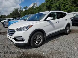 2018 Hyundai Santa Fe 2.4L с VIN 5NMZU3LB4JH103014, выставлен на аукционе Copart как лот 68169535 с пробегом 124 444 миль миль и Списание • Salvage title. История ставок и продаж доступна на DreamBid. Изображение 1.