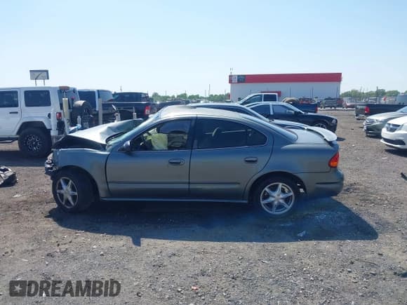 ✅ 2004 Oldsmobile Alero GL1 • VIN: 1G3NL52E74C160903 • Lot: 42029384. Wystawiony na IAAI z przebiegiem 135 086 mil. Bezpłatny archiwum sprzedaży aukcyjnych z USA i szczegółowy raport historii pojazdu na DreamBid. Zdjęcie 14.