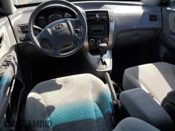 2005 Hyundai Tucson GLS z VIN KM8JN72D75U169698, wystawiony jako Copart lot #71572094 z przebiegiem 149 706 mil mil oraz Szkoda całkowita • Salvage title. Historia ofert i sprzedaży dostępna na DreamBid. Obrazek 8.