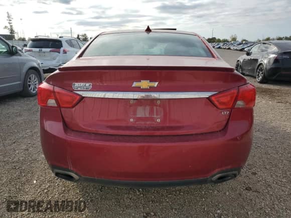 2014 Chevrolet Impala LTZ with VIN 1G1155S36EU145708, listed as a Copart auction lot 82423055 with 140,731 mi miles and Salvage title. Bid and sale history available at DreamBid. Image 6.