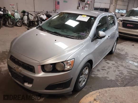 2013 Chevrolet Sonic LT with VIN 1G1JD6SH7D4203621, listed as a IAAI auction lot 41546319 with 201,164 mi miles and . Bid and sale history available at DreamBid. Image 2.