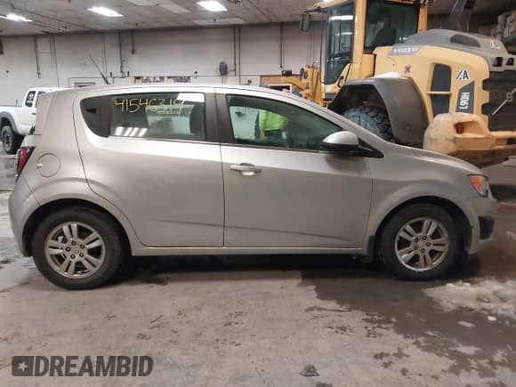2013 Chevrolet Sonic LT with VIN 1G1JD6SH7D4203621, listed as a IAAI auction lot 41546319 with 201,164 mi miles and . Bid and sale history available at DreamBid. Image 14.