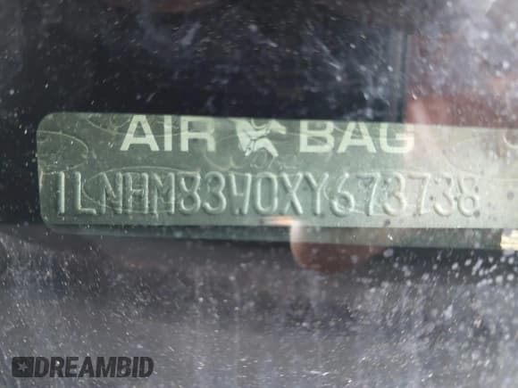 ✅ 1999 Lincoln Town Car Cartier • VIN: 1LNHM83W0XY673738 • Lot: 42437877. Listed on IAAI with 143,018 mi. Free auction sales archive from the USA and detailed vehicle history report at DreamBid. Image 9.