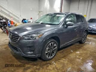 ✅ 2016 Mazda CX-5 Grand Touring • VIN: JM3KE4DY5G0856557 • Lot: 94638595. Wystawiony na Copart z przebiegiem 60 166 mil. Bezpłatny archiwum sprzedaży aukcyjnych z USA i szczegółowy raport historii pojazdu na DreamBid. Zdjęcie 1.