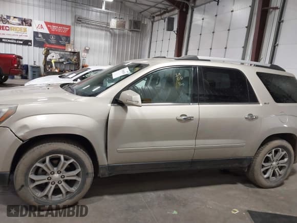 ✅ 2015 GMC Acadia SLT • VIN: 1GKKVSKD1FJ301342 • Lot: 43566026. Listed on IAAI with 103,023 mi. Free auction sales archive from the USA and detailed vehicle history report at DreamBid. Image 14.