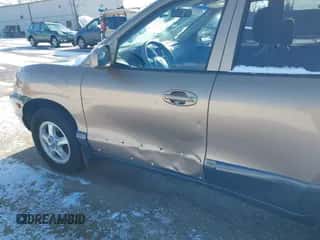 2002 Hyundai Santa Fe GLS z VIN KM8SC73D62U316002, wystawiony jako IAAI lot #41249855 z przebiegiem Nie podano mil oraz . Historia ofert i sprzedaży dostępna na DreamBid. Obrazek 6.