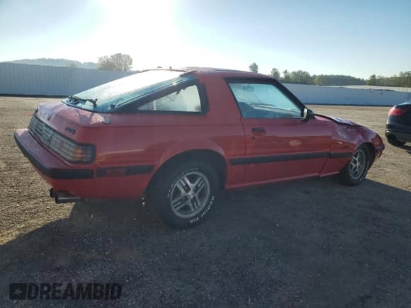 ✅ 1985 Mazda RX-7 • VIN: JM1FB3311F0858774 • Lot: 72128824. Wystawiony na Copart z przebiegiem 100 018 mil. Bezpłatny archiwum sprzedaży aukcyjnych z USA i szczegółowy raport historii pojazdu na DreamBid. Zdjęcie 3.