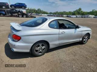 2001 Hyundai Tiburon с VIN KMHJG25FX1U237982, выставлен на аукционе Copart как лот 65774595 с пробегом 125 241 миль миль и Списание • Salvage title. История ставок и продаж доступна на DreamBid. Изображение 3.