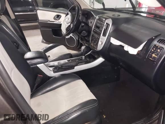 2006 Mercury Mariner Luxury z VIN 4M2CU56126KJ03006, wystawiony jako IAAI lot #42476543 z przebiegiem 114 288 mil mil oraz . Historia ofert i sprzedaży dostępna na DreamBid. Obrazek 5.