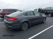 ✅ 2018 Ford Fusion Titanium • VIN: 3FA6P0RUXJR124344 • Lot: 42890852. Wystawiony na IAAI z przebiegiem 164 730 mil. Bezpłatny archiwum sprzedaży aukcyjnych z USA i szczegółowy raport historii pojazdu na DreamBid. Zdjęcie 4.