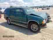 1997 Chevrolet Blazer LS with VIN 1GNCS13W3V2240627, listed as a Copart auction lot 67757765 with 218,953 mi miles and Salvage title. Bid and sale history available at DreamBid. Image 4.