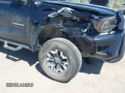 ✅ 2012 Toyota Tacoma PreRunner • VIN: 3TMJU4GN8CM136850 • Lot: 42767423. Listed on IAAI with 128,151 mi. Free auction sales archive from the USA and detailed vehicle history report at DreamBid. Image 6.