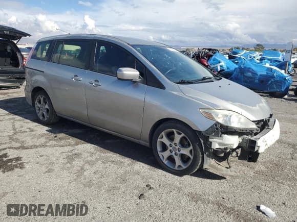 ✅ 2010 Mazda 5 Touring • VIN: JM1CR2W35A0382981 • Лот: 92050545. Опубликован ранее на Copart с пробегом 126 939 миль. Бесплатный доступ к архиву аукционных продаж из США и подробный отчёт об истории автомобиля на DreamBid. Изображение 4.