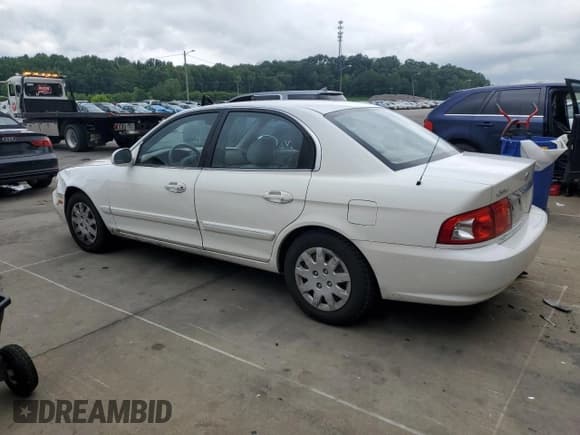 ✅ 2005 Kia Optima LX • VIN: KNAGD126455379263 • Lot: 64826385. Listed on Copart with 78,774 mi. Free auction sales archive from the USA and detailed vehicle history report at DreamBid. Image 2.