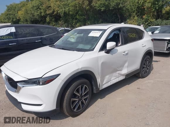 ✅ 2017 Mazda CX-5 Grand Touring • VIN: JM3KFBDL0H0210818 • Lot: 43203471. Wystawiony na IAAI z przebiegiem 104 966 mil. Bezpłatny archiwum sprzedaży aukcyjnych z USA i szczegółowy raport historii pojazdu na DreamBid. Zdjęcie 2.