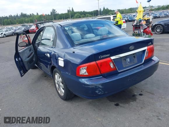 ✅ 2005 Kia Optima LX • VIN: KNAGD128455390068 • Lot: 42466140. Listed on IAAI with 128,832 mi. Free auction sales archive from the USA and detailed vehicle history report at DreamBid. Image 3.