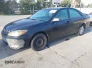 ✅ 2002 Toyota Camry LE • VIN: 4T1BE32K22U566503 • Lot: 43806284. Listed on IAAI with 244,198 mi. Free auction sales archive from the USA and detailed vehicle history report at DreamBid. Image 2.