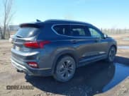 ✅ 2020 Hyundai Santa Fe Limited • VIN: 5NMS5CAA0LH208063 • Лот: 42131296. Опубликован ранее на IAAI с пробегом 65 030 миль. Бесплатный доступ к архиву аукционных продаж из США и подробный отчёт об истории автомобиля на DreamBid. Изображение 4.