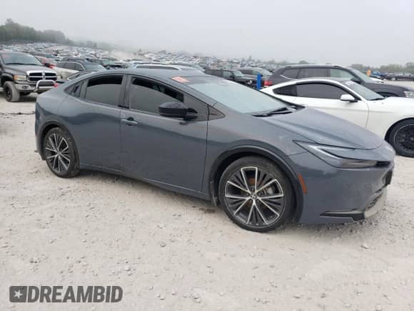 2023 Toyota Prius LE с VIN JTDACAAU9P3003815, выставлен на аукционе Copart как лот 69556365 с пробегом 60 912 миль миль и Списание • Salvage title. История ставок и продаж доступна на DreamBid. Изображение 4.