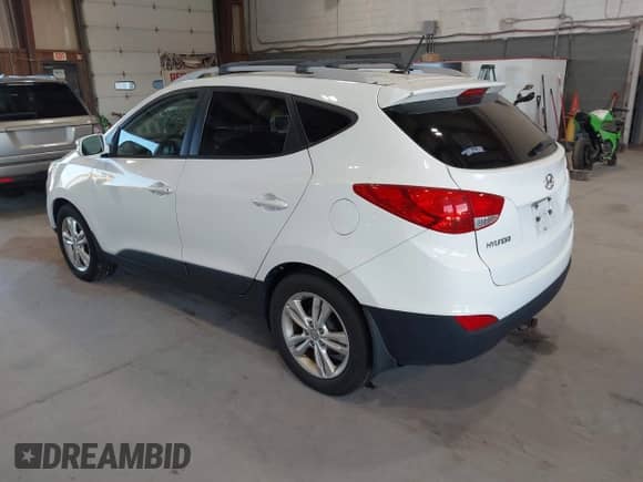 2013 Hyundai Tucson Limited with VIN KM8JUCAC7DU693839, listed as a IAAI auction lot 43026808 with 205,556 mi miles and . Bid and sale history available at DreamBid. Image 3.