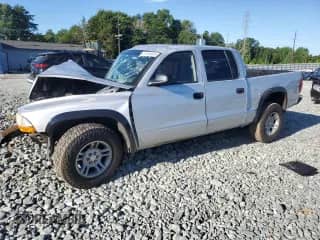 2003 Dodge Dakota Sport z VIN 1D7HL38X53S123451, wystawiony jako Copart lot #61164635 z przebiegiem Nie podano mil oraz Szkoda całkowita • Salvage title. Historia ofert i sprzedaży dostępna na DreamBid. Obrazek 1.