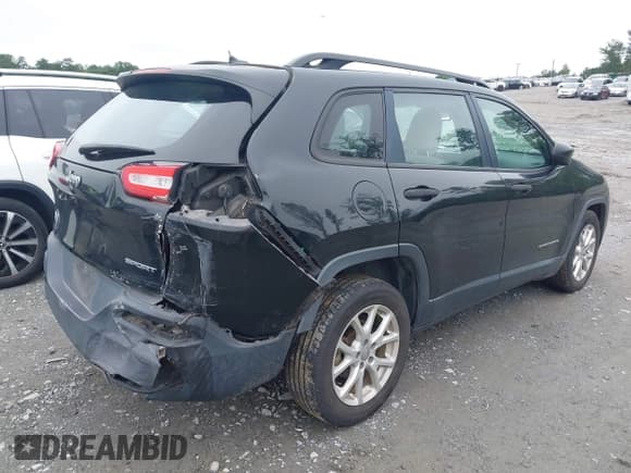 ✅ 2015 Jeep Cherokee Sport • VIN: 1C4PJLAB0FW761467 • Lot: 42362433. Listed on IAAI with 133,794 mi. Free auction sales archive from the USA and detailed vehicle history report at DreamBid. Image 4.