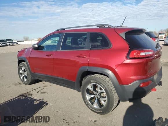 ✅ 2015 Jeep Cherokee Trailhawk • VIN: 1C4PJMBS0FW563072 • Lot: 92593655. Listed on Copart with 64,401 mi. Free auction sales archive from the USA and detailed vehicle history report at DreamBid. Image 2.