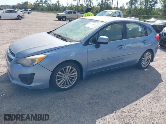 ✅ 2012 Subaru Impreza Premium • VIN: JF1GPAE67CH230918 • Lot: 43383808. Listed on IAAI with 124,512 mi. Free auction sales archive from the USA and detailed vehicle history report at DreamBid. Image 2.