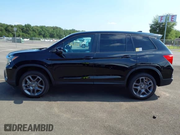 ✅ 2023 Honda Passport EX-L • VIN: 5FNYF8H51PB009494 • Lot: 42751895. Listed on IAAI with 24,085 mi. Free auction sales archive from the USA and detailed vehicle history report at DreamBid. Image 13.