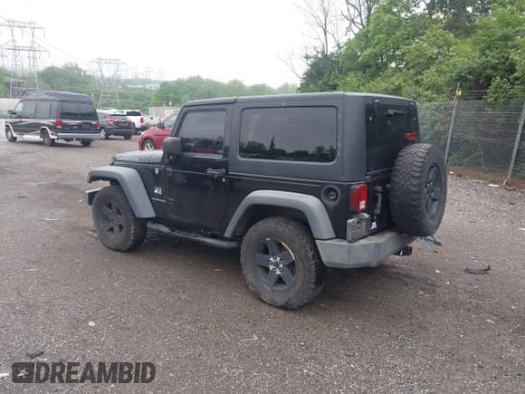 ✅ 2007 Jeep Wrangler Rubicon • VIN: 1J4GA64117L149666 • Lot: 42252464. Listed on IAAI with 100,791 mi. Free auction sales archive from the USA and detailed vehicle history report at DreamBid. Image 3.