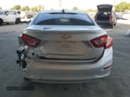 ✅ 2018 Chevrolet Cruze LS • VIN: 1G1BC5SM7J7134731 • Lot: 82364625. Listed on Copart with 84,754 mi. Free auction sales archive from the USA and detailed vehicle history report at DreamBid. Image 6.