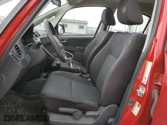 ✅ 2013 Suzuki SX4 LE • VIN: JS2YC5A34D6100482 • Lot: 50810535. Wystawiony na Copart z przebiegiem 72 231 mil. Bezpłatny archiwum sprzedaży aukcyjnych z USA i szczegółowy raport historii pojazdu na DreamBid. Zdjęcie 7.