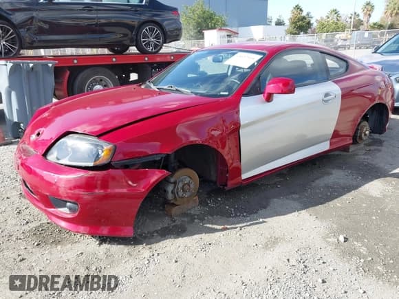 ✅ 2005 Hyundai Tiburon GS • VIN: KMHHM65D45U183100 • Лот: 43627934. Опубликован ранее на IAAI с пробегом 130 401 миль. Бесплатный доступ к архиву аукционных продаж из США и подробный отчёт об истории автомобиля на DreamBid. Изображение 2.