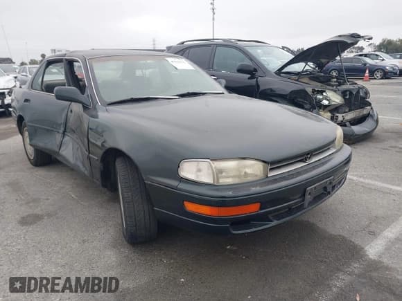 ✅ 1994 Toyota Camry LE • VIN: 4T1GK12E7RU057451 • Лот: 42417533. Опубликован ранее на IAAI с пробегом 421 184 миль. Бесплатный доступ к архиву аукционных продаж из США и подробный отчёт об истории автомобиля на DreamBid. Изображение 1.