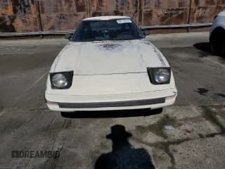 ✅ 1985 Mazda RX-7 • VIN: JM1FB3310F0860015 • Lot: 80110214. Wystawiony na Copart z przebiegiem 145 208 mil. Bezpłatny archiwum sprzedaży aukcyjnych z USA i szczegółowy raport historii pojazdu na DreamBid. Zdjęcie 5.