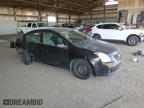 ✅ 2009 Nissan Sentra S • VIN: 3N1AB61E39L608934 • Lot: 84935665. Wystawiony na Copart z przebiegiem 200 654 mil. Bezpłatny archiwum sprzedaży aukcyjnych z USA i szczegółowy raport historii pojazdu na DreamBid. Zdjęcie 13.