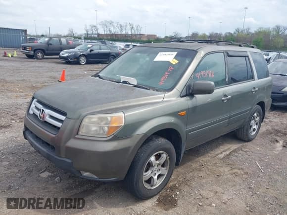 ✅ 2007 Honda Pilot EX-L • VIN: 5FNYF28617B039309 • Lot: 41951978. Listed on IAAI with 239,583 mi. Free auction sales archive from the USA and detailed vehicle history report at DreamBid. Image 6.