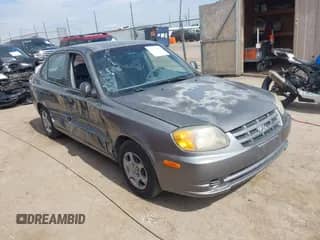 2005 Hyundai Accent GLS z VIN KMHCG45C85U604815, wystawiony jako IAAI lot #43372328 z przebiegiem 172 000 mil mil oraz . Historia ofert i sprzedaży dostępna na DreamBid. Obrazek 1.