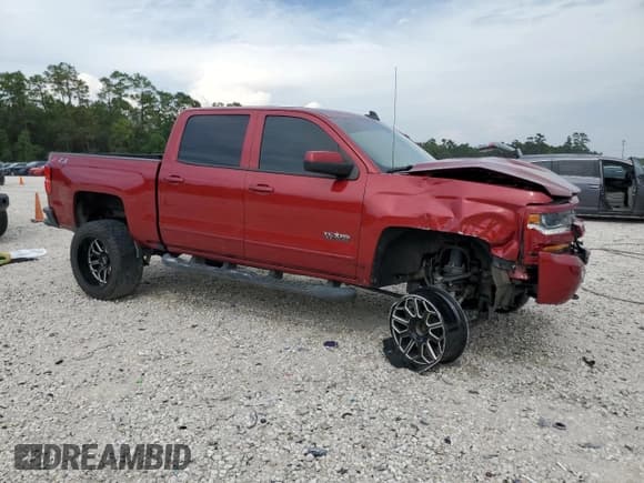 ✅ 2018 Chevrolet Silverado 1500 LT • VIN: 3GCUKREC4JG179403 • Лот: 70026954. Опубликован ранее на Copart с пробегом 96 670 миль. Бесплатный доступ к архиву аукционных продаж из США и подробный отчёт об истории автомобиля на DreamBid. Изображение 4.