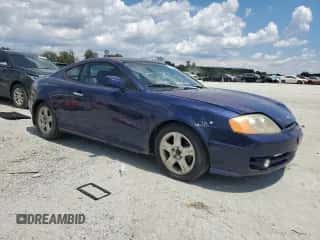 2003 Hyundai Tiburon GT с VIN KMHHN65F93U046097, выставлен на аукционе Copart как лот 66706235 с пробегом 158 369 миль миль и Списание • Salvage title. История ставок и продаж доступна на DreamBid. Изображение 4.